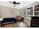 Cozy bedroom with a double bed, armchair, and plenty of natural light at 2499 Indigo Dr, Clearwater, FL 33763