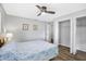 Cozy bedroom with a ceiling fan and built-in closet at 2499 Indigo Dr, Clearwater, FL 33763