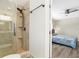 Updated bathroom with a walk-in shower and a vanity with granite countertop at 2499 Indigo Dr, Clearwater, FL 33763