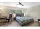 Bright bedroom with wood flooring and a view of lush greenery at 2499 Indigo Dr, Clearwater, FL 33763