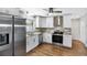 Updated kitchen featuring stainless steel appliances and white shaker cabinets at 2499 Indigo Dr, Clearwater, FL 33763