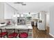 Eat-in kitchen with breakfast bar and modern lighting fixtures at 2499 Indigo Dr, Clearwater, FL 33763