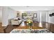 Bright living room with hardwood floors, comfy seating, and a dining area at 2499 Indigo Dr, Clearwater, FL 33763