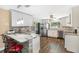 Modern kitchen with breakfast bar and stainless steel appliances at 2499 Indigo Dr, Clearwater, FL 33763