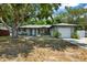 Single story home with a landscaped yard and attached garage at 2499 Indigo Dr, Clearwater, FL 33763
