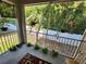 Screened porch with lush greenery and hanging plants at 1427 Hillview Ln, Tarpon Springs, FL 34689