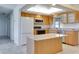 Modern kitchen with light wood cabinets and island at 3501 10Th Ne St, St Petersburg, FL 33704