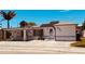 Single story home with solar panels and paved driveway at 14845 N Bayshore Dr, Madeira Beach, FL 33708