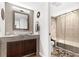 Modern bathroom featuring a vessel sink, decorative mirror, and tiled shower/tub combination at 240 Windward Psge # 602, Clearwater Beach, FL 33767