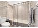 Tile bathroom with a shower and tub combination, plus a toilet and wall-mounted fixtures at 240 Windward Psge # 602, Clearwater Beach, FL 33767