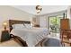 Comfortable bedroom featuring sliding door to a balcony and plenty of natural light at 240 Windward Psge # 602, Clearwater Beach, FL 33767