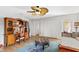 Inviting bedroom with desk, wooden floors, ceiling fan, and natural light at 240 Windward Psge # 602, Clearwater Beach, FL 33767