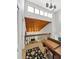 Spacious foyer features vaulted ceilings, skylights, railing, and a view to the living area at 240 Windward Psge # 602, Clearwater Beach, FL 33767