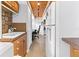 Hallway area with wood ceiling, built-in cabinets, connecting to a home office and sink at 240 Windward Psge # 602, Clearwater Beach, FL 33767