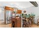Kitchen with stainless steel appliances, wine rack, and seating at 240 Windward Psge # 602, Clearwater Beach, FL 33767