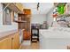 Well-lit laundry room with tile flooring, cabinets, and a modern washing machine offers practical convenience at 240 Windward Psge # 602, Clearwater Beach, FL 33767