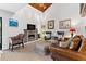 Comfortable living room with hardwood floors, a fireplace, TV, and plenty of seating at 240 Windward Psge # 602, Clearwater Beach, FL 33767