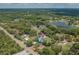 A location-aware aerial view shows the proximity of the home to nearby lakes and conservation areas at 7414 Van Dyke Rd, Odessa, FL 33556