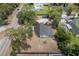 An aerial view showing the layout of the property, including the home, garage, and surrounding land at 7414 Van Dyke Rd, Odessa, FL 33556