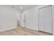 Bright bedroom with hardwood floors and a spacious closet at 7414 Van Dyke Rd, Odessa, FL 33556