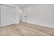 Bright bedroom with hardwood floors and a spacious closet at 7414 Van Dyke Rd, Odessa, FL 33556