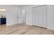 Bright bedroom with hardwood floors, closet, and ensuite bathroom access at 7414 Van Dyke Rd, Odessa, FL 33556