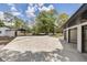 Long driveway leading to a detached garage, carport, and main house of this beautiful property at 7414 Van Dyke Rd, Odessa, FL 33556