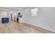 Bright living area with hardwood floors, and open to the modern kitchen at 7414 Van Dyke Rd, Odessa, FL 33556