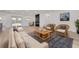 Cozy living room featuring comfortable seating, neutral tones, and a decorative fireplace at 7414 Van Dyke Rd, Odessa, FL 33556