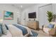 A relaxing main bedroom with a beachy theme and lots of natural light at 7414 Van Dyke Rd, Odessa, FL 33556
