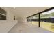 Spacious covered patio with sleek design, offering a versatile outdoor living space at 7414 Van Dyke Rd, Odessa, FL 33556