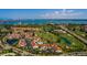 Expansive aerial view highlighting the community's proximity to the water, golf course, and amenities at 6011 Bahia Del Mar Blvd # 150, St Petersburg, FL 33715