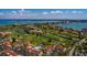 Beautiful aerial view showcasing the community pool, lush landscaping, and waterfront location at 6011 Bahia Del Mar Blvd # 150, St Petersburg, FL 33715