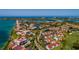 High angle view of a coastal community featuring lush landscaping and a bridge in the distance at 6011 Bahia Del Mar Blvd # 150, St Petersburg, FL 33715