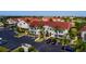 Aerial view of the building's exterior, parking lot, and surrounding landscape at 6011 Bahia Del Mar Blvd # 150, St Petersburg, FL 33715