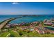 Breathtaking aerial view showcasing the community's proximity to the water, golf course, and bridge at 6011 Bahia Del Mar Blvd # 150, St Petersburg, FL 33715