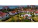 An aerial view of a waterfront condo community with a pool, bridge and bay views at 6011 Bahia Del Mar Blvd # 150, St Petersburg, FL 33715