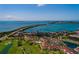 Exceptional aerial view of the community, highlighting the pool, golf course, and surrounding waterfront at 6011 Bahia Del Mar Blvd # 150, St Petersburg, FL 33715