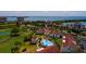 Aerial view of a condo community with a pool, overlooking the golf course and waterfront at 6011 Bahia Del Mar Blvd # 150, St Petersburg, FL 33715