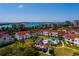 Aerial view of a condo community with pool, waterfront and bridge views, near golf course at 6011 Bahia Del Mar Blvd # 150, St Petersburg, FL 33715