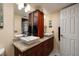 Bathroom featuring dual vessel sinks, granite countertops, and ample storage at 6011 Bahia Del Mar Blvd # 150, St Petersburg, FL 33715