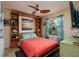 Cozy guest bedroom with a Murphy bed, built-in shelving, and a window view at 6011 Bahia Del Mar Blvd # 150, St Petersburg, FL 33715