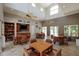 Clubhouse interior with high ceilings, tables and chairs, a small kitchen, and bookshelves at 6011 Bahia Del Mar Blvd # 150, St Petersburg, FL 33715