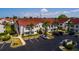 Exterior of a residential building with parking area and landscaping at 6011 Bahia Del Mar Blvd # 150, St Petersburg, FL 33715