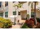 Front entrance of a unit with a walkway, landscaping, and unit numbers at 6011 Bahia Del Mar Blvd # 150, St Petersburg, FL 33715