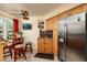 Kitchen with stainless steel appliances, wood cabinetry, and a cozy breakfast nook at 6011 Bahia Del Mar Blvd # 150, St Petersburg, FL 33715