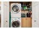 Laundry area with stacked washer and dryer and ample storage space at 6011 Bahia Del Mar Blvd # 150, St Petersburg, FL 33715