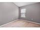 Simple bedroom with neutral walls and carpet at 2619 Redford Way, Wesley Chapel, FL 33544