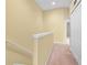 Upstairs hallway with carpet and access to bedrooms at 2619 Redford Way, Wesley Chapel, FL 33544