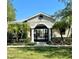 Community pool with gated entrance and landscaping at 2619 Redford Way, Wesley Chapel, FL 33544
